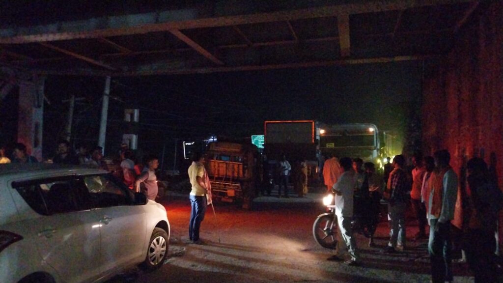 Trucks occupy one-way road, causing inconvenience to pedestrians. NewG India